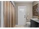 Bathroom with exterior access and updated vanity at 3401 W North B St, Tampa, FL 33609