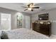 Primary bedroom with king bed, dresser, and ensuite bathroom at 3401 W North B St, Tampa, FL 33609