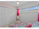 Charming bedroom with pink walls and white brick accent wall at 3401 W North B St, Tampa, FL 33609