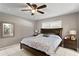 Primary bedroom with king-size bed and ceiling fan at 3401 W North B St, Tampa, FL 33609