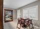 Small dining area with a game table and chairs, and a large display cabinet at 3401 W North B St, Tampa, FL 33609