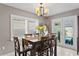 Bright dining area with table and chairs, view to pool at 3401 W North B St, Tampa, FL 33609