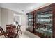 Two large display cabinets filled with collectibles line a hallway at 3401 W North B St, Tampa, FL 33609