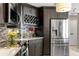 Kitchen features dark cabinetry, wine rack, and stainless steel appliances at 3401 W North B St, Tampa, FL 33609