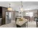 Open concept kitchen with granite countertops and stainless steel appliances at 3401 W North B St, Tampa, FL 33609