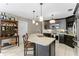 Modern kitchen with granite island and stainless steel appliances at 3401 W North B St, Tampa, FL 33609