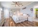 Spacious bedroom with wood-look floors and mirrored closet doors at 37635 Gill Ave, Zephyrhills, FL 33541