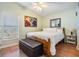 Bedroom with wood-look floors and a wooden bed frame at 37635 Gill Ave, Zephyrhills, FL 33541