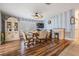 Bright dining area with wood floors and built-in hutch at 37635 Gill Ave, Zephyrhills, FL 33541