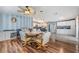 Open dining area with kitchen view and wood floors at 37635 Gill Ave, Zephyrhills, FL 33541