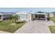 Single-Gathering home with covered patio and paved driveway at 37635 Gill Ave, Zephyrhills, FL 33541
