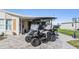 Golf cart parked on paver driveway near home entrance at 37635 Gill Ave, Zephyrhills, FL 33541