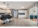 Open kitchen with white cabinets, an island, and tile flooring at 37635 Gill Ave, Zephyrhills, FL 33541