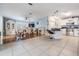 Open kitchen with breakfast bar and stainless steel appliances at 37635 Gill Ave, Zephyrhills, FL 33541