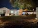Backyard view at night, showing home and patio at 1114 Palm Bluff St, Clearwater, FL 33755