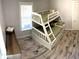 Bedroom with a bunk bed and wood-look floors at 1114 Palm Bluff St, Clearwater, FL 33755
