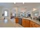 Kitchen with granite countertops, wood cabinets and island at 1120 Emerald Dunes Dr, Sun City Center, FL 33573