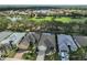 Community overview featuring homes, golf course, and lake at 1120 Emerald Dunes Dr, Sun City Center, FL 33573