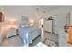 Guest bedroom with queen bed and en-suite bathroom access at 1120 Emerald Dunes Dr, Sun City Center, FL 33573