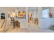 Open kitchen with island, wood cabinets, and stainless steel appliances at 1120 Emerald Dunes Dr, Sun City Center, FL 33573