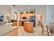 Modern kitchen with wood cabinets, an island, and black appliances at 1120 Emerald Dunes Dr, Sun City Center, FL 33573
