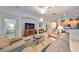 Living room with comfortable seating, large TV, and open floor plan at 1120 Emerald Dunes Dr, Sun City Center, FL 33573