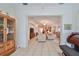 View from sunroom into the living room and kitchen area at 1120 Emerald Dunes Dr, Sun City Center, FL 33573