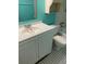 Bathroom with white vanity and teal walls at 1125 83Rd N Ave # A, St Petersburg, FL 33702