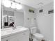 Clean bathroom with white vanity and toilet at 14462 91St Ave, Seminole, FL 33776