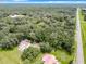 Aerial view of a property with houses and a large wooded lot at 16206 Boyette Rd, Riverview, FL 33579