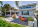 Contemporary house exterior with landscaped yard and fire pit at 16434 Redington Dr, Redington Beach, FL 33708
