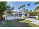 Outdoor kitchen and patio area with fire pit and seating at 16434 Redington Dr, Redington Beach, FL 33708