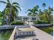Private dock with seating area, offering waterfront access at 16434 Redington Dr, Redington Beach, FL 33708