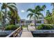 Mid-century modern home with backyard and private dock at 16434 Redington Dr, Redington Beach, FL 33708