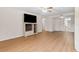 Bright living room with laminate floors and built-in shelving at 1950 59Th N Ave # 114, St Petersburg, FL 33714