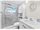 Updated bathroom with walk-in shower and white cabinets at 1950 59Th N Ave # 114, St Petersburg, FL 33714