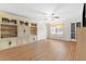 Bright living room with laminate floors and built-in shelving at 1950 59Th N Ave # 114, St Petersburg, FL 33714