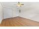 Bright bedroom featuring wood-look flooring and ceiling fan at 1950 59Th N Ave # 114, St Petersburg, FL 33714