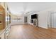 Bright living room with laminate floors and built-in shelving at 1950 59Th N Ave # 114, St Petersburg, FL 33714