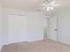 Spacious bedroom with double doors and window at 2012 Deltona Blvd, Spring Hill, FL 34606