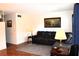 Living room with sectional sofa, end tables, and lamps near window at 2100 World Parkway Blvd # 58, Clearwater, FL 33763