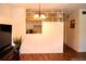 View into kitchen from living area with pass-through at 2100 World Parkway Blvd # 58, Clearwater, FL 33763
