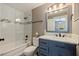 Updated bathroom with a tub and modern vanity at 2134 Serpentine S Cir, St Petersburg, FL 33712