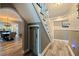 Inviting hallway with gray walls, wood-look floors, and built-in storage at 2134 Serpentine S Cir, St Petersburg, FL 33712