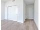 Simple bedroom with double door closet and wood-look tile flooring at 2912 W Santiago St # 2204, Tampa, FL 33629
