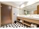 Spa-like bathroom with double sinks and geometric tile floors at 2912 W Santiago St # 2204, Tampa, FL 33629