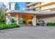 Modern building entrance with valet service and landscaped grounds at 2912 W Santiago St # 2204, Tampa, FL 33629