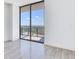 Bright bedroom with sliding glass doors leading to a balcony and city views at 2912 W Santiago St # 2204, Tampa, FL 33629