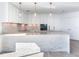 Modern kitchen with white cabinets, marble countertops, and high-end appliances at 2912 W Santiago St # 2204, Tampa, FL 33629