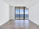 Spacious bedroom with floor-to-ceiling windows and water views at 2912 W Santiago St # 2204, Tampa, FL 33629